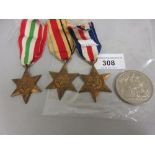 Group of three World War II medals, Italy Star, Africa Star, France and Germany Star and a 1951 five