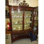 Good quality Edwardian mahogany serpentine shaped display cabinet with Prince of Wales feathers