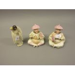 Pair of Continental porcelain nodding head figures together with a Chinese pottery figure of a