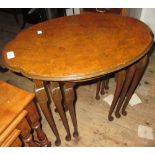 Nest of three 1930's oval figured walnut occasional tables