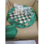 Small Italian malachite and marble circular chess board with chess pieces, together with similar box
