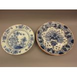 Antique Delft ware charger painted with a typical floral design, 13.75ins diameter, together with