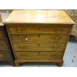 George III mahogany dwarf chest with a moulded top above four graduated drawers with brass handles