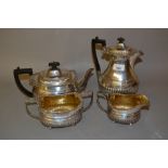 Victorian Scottish silver four piece tea service of oval half fluted design with shell pattern