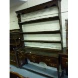 18th Century oak dresser, the associated shelf back above a moulded top with six drawers and a
