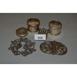 Two cast silver buckles, two silver vesta cases and a pair of silver napkin rings