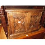 20th Century low oak cabinet with two geometric moulded panelled doors on a plinth base