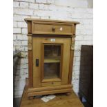 Pine bedside cabinet having single drawer with knob handle above a glazed panelled door with shelf
