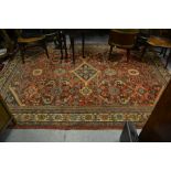 Mahal carpet with a medallion and all-over stylised floral design on a red ground with borders (