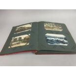 Red Art Deco album of over eighty foreign cards, Singapore, Java, Japan, China, etc