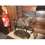 Large dark patinated bronze figure of a 16th Century gentleman on horseback, with an oval