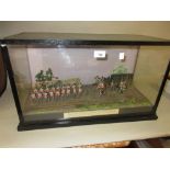 20th Century ebonised and glazed case displaying a scene from the morning of the battle of Waterloo