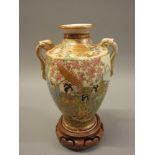 Small Satsuma two handled baluster vase painted with figures in landscapes, two character mark to