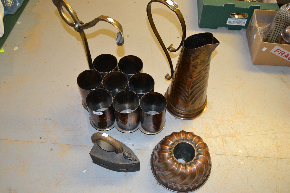 Unusual brass mounted copper eight division wine bottle carrier together with a large jug, copper