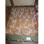 Box containing a collection of various Stuart crystal wine glasses and other sets of glasses
