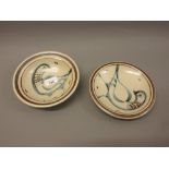 Two Svend Bayer Studio pottery dishes decorated with figures of birds Firing fault to rim as shown