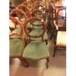 Set of four Victorian carved walnut balloon back dining room chairs with upholstered seats and