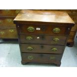 George III mahogany bachelors chest with a fold-over top above four graduated drawers with oval