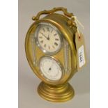 French oval brass compendium clock with two circular dials for time and barometer and two silvered