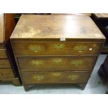 Early 19th Century mahogany dwarf chest of three graduated drawers with brass handles raised on