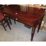 19th Century mahogany D-shaped fold-over card table, raised on turned fluted and tapering supports