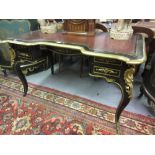Late 19th Century French ebonised cut brass inlaid and gilt brass mounted writing desk, the shaped