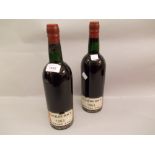 Two bottles Cockburns 1963 vintage port Both top shoulder