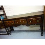 18th Century oak dresser base, the moulded plank top above three drawers and a shaped frieze