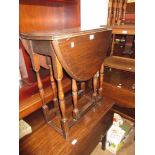 Small oak oval gate leg table and an octagonal bevelled edge wall mirror