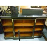 Victorian ebonised and gilt brass mounted dwarf breakfront bookcase, the moulded top above