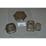 Silver vesta case inset with a coin, another silver vesta case, a plated vesta case and a silver