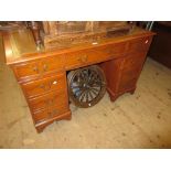 Reproduction yew wood twin pedestal desk with a leather inset top above nine drawers and bracket