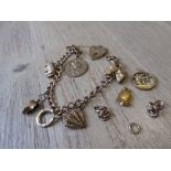 9ct Gold charm bracelet with various unmounted charms and links 27g