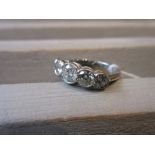 Platinum ring set five graduated brilliant cut diamonds, approximately 1.50ct total Size M/N