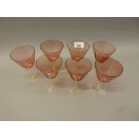 Set of six coloured wine glasses and another matching glass