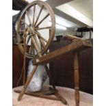 19th Century pine spinning wheel with turned decoration and turned supports