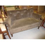 Edwardian upholstered two seat sofa raised on low mahogany cabriole supports