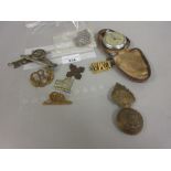 Small quantity of various military cap badges including a Temperance medallion dated 1889 and a