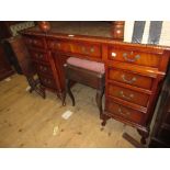 Reproduction mahogany twin pedestal desk, raised on low cabriole supports