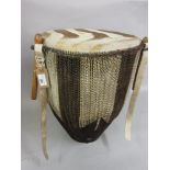African hide covered drum with sticks (straps at fault)