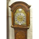 Figured walnut longcase clock, the broken arch hood with flanking pilasters above a moulded panel