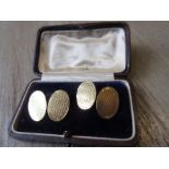 Pair of 15ct yellow gold engine turned decorated cufflinks in fitted box 9g