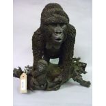 20th Century resin figure of a female gorilla with young on a naturalistic base, 13ins high