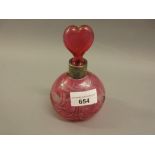 Silver mounted cranberry glass perfume bottle with heart shaped stopper