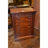 Victorian mahogany seven drawer Wellington type table top collector's chest The lock is present, but