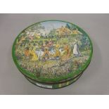 Huntley and Palmer's circular biscuit tin, the cover printed with figures at a tea party, 8ins