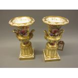 Pair of 19th Century Paris porcelain campana vases with detachable pedestal bases, hand painted with
