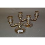 Pair of (835 mark) silver twin arm candlesticks on circular bases