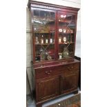 George III mahogany secretaire bookcase with a moulded cornice above a pair of bar glazed doors