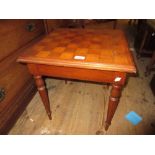 20th Century square topped games table with single drawer on turned tapering reeded supports, long